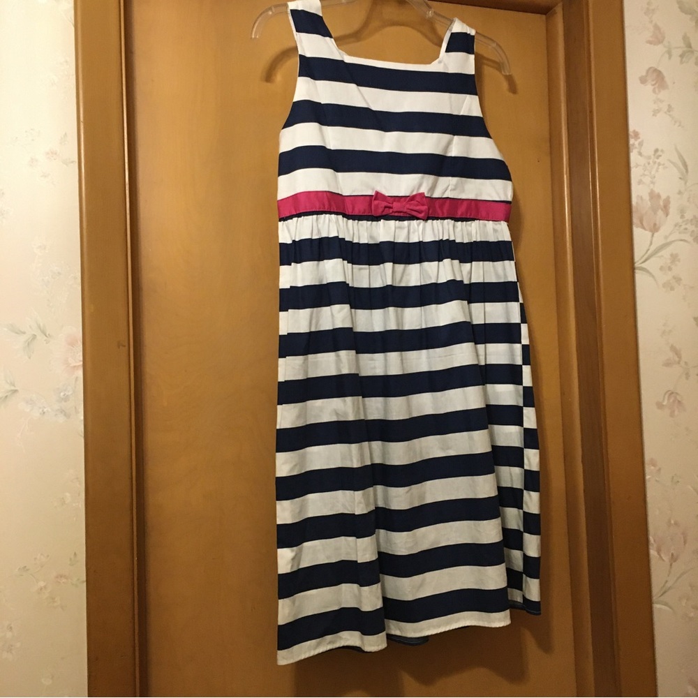 Girls navy and white striped dress with bright pink bow detail